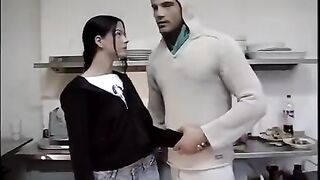 The man fucked the young brunette in the kitchen without mercy