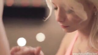 A sexy blonde woman makes a blowjob in the studio
