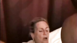 A beautiful mature woman is being fucked by a black man