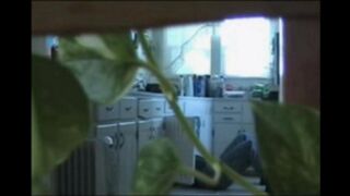 A married couple has fun on the naked walk around their apartment