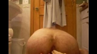 A girl has anal sex with a rubber cock - homemade