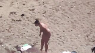 A couple enjoys intimacy without any clothes on the sea