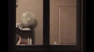 A hot guy admires himself in the mirror, completely naked, with a big dick