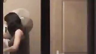 A hot guy admires himself in the mirror, completely naked, with a big dick
