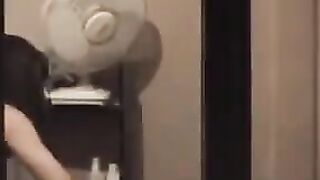 A hot guy admires himself in the mirror, completely naked, with a big dick