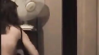 A hot guy admires himself in the mirror, completely naked, with a big dick