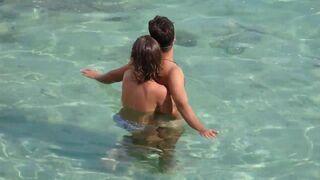 Girl fingers guy underwater in the sea