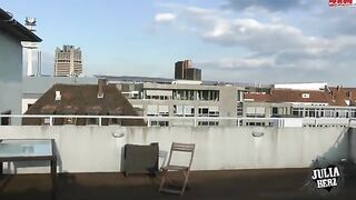 A hot brunette with big tits bounces on the cock on the roof terrace in HD