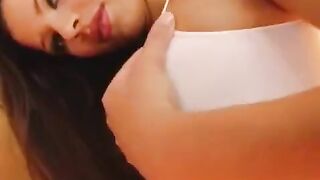 A girl plays with a dildo and shows her big wet vagina