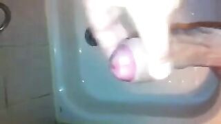 The kid caresses his dick under the shower jet, trying to bring himself to a strong orgasm