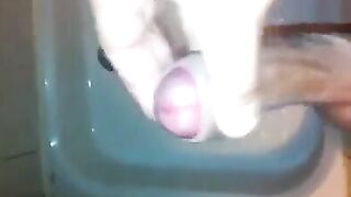 The kid caresses his dick under the shower jet, trying to bring himself to a strong orgasm