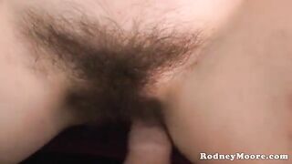 A cute girl has sex with her hairy neighbor on the couch