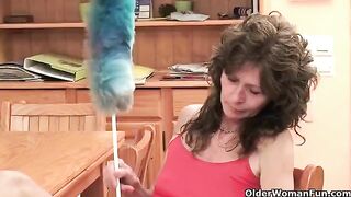 A mature woman plays with her pussy using a finger and a toy