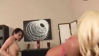Fisting and lesbian sex with a girl in a skirt on the bed