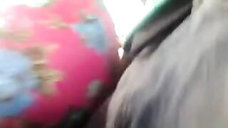 A man masturbates on a riser through the window of a moving bus