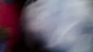 A man masturbates on a riser through the window of a moving bus