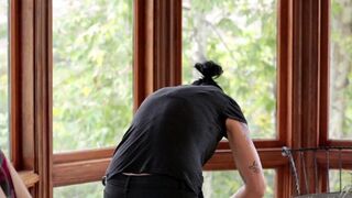 A cute Vietnamese girl fucks a virgin in the kitchen with a strap-on dildo