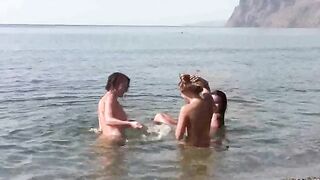 Nudists enjoy each other's company on the naked beach