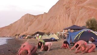 A hot naked girl is playing volleyball on the beach