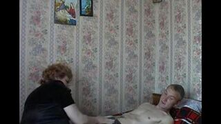 An appetizing woman has sex with her son, who has a camera