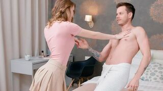 Naked lovers chat while lying on the bed