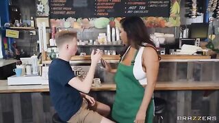 Girl with big boobs working as a barista