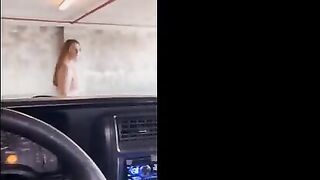 Redhead babe flashes and gets banged in the public garage, right in the middle of action