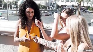 A pair of girls are having fun on the strip