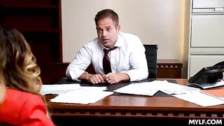A pair of MILFs are having fun in the office