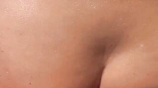 A girl with an open ass hole is having fun on the beach with anyone