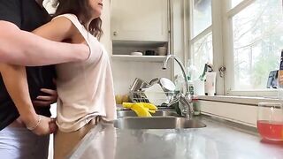 A mature woman with big tits gets fucked in the kitchen