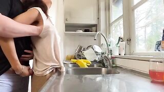 A mature woman with big tits gets fucked in the kitchen