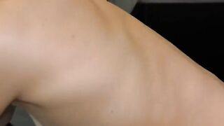Blonde woman in the kitchen, her small body captured in steamy detail