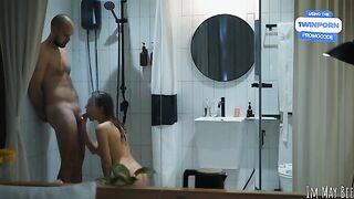 A couple has an intense encounter in a small shower stall, full of passion
