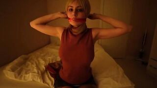 Girl in black stockings plays with a big dildo, embodying Resident Evil’s intense vibe