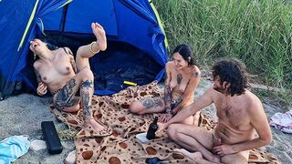 Two girls have sex in the woods, playing a sexy version of spin the bottle